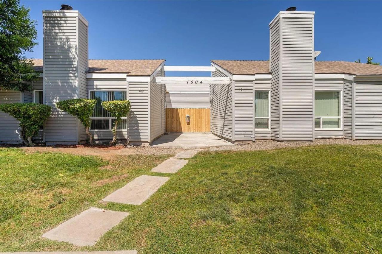 1504 Pierce Drive, Unit 102 Clovis, CA 93612 - Photo 1 of 20 a front view of a building with glass windows