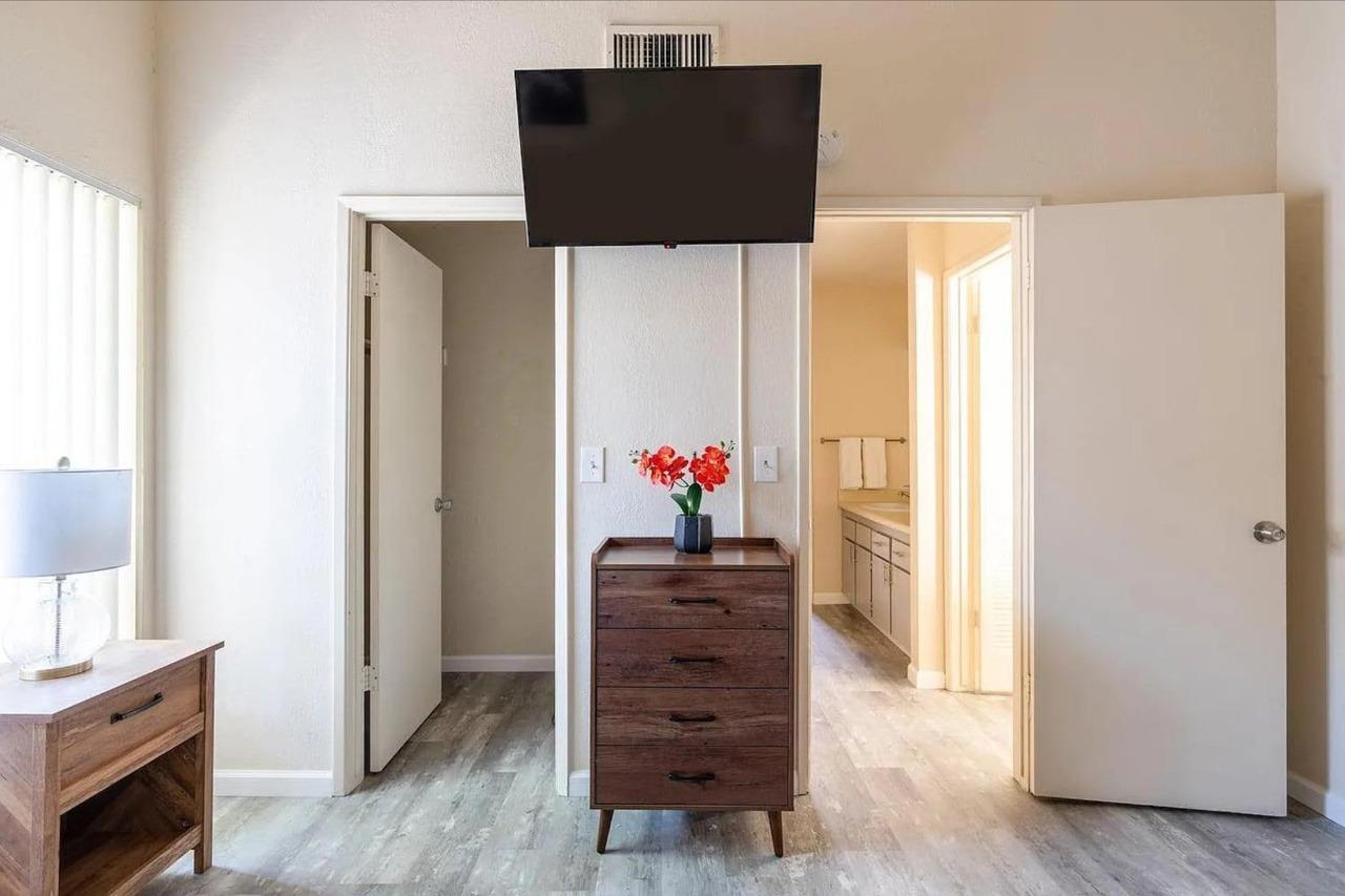 1504 Pierce Drive, Unit 102 Clovis, CA 93612 - Photo 12 of 20 a view of a hallway with wooden floor and cabinet