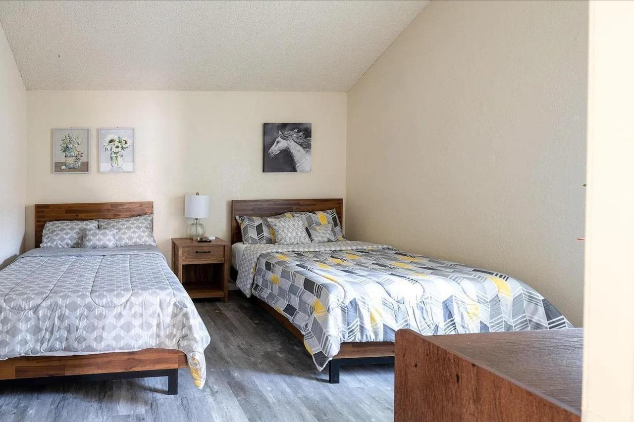 1504 Pierce Drive, Unit 102 Clovis, CA 93612 - Photo 13 of 20 a bedroom with a bed and a couch