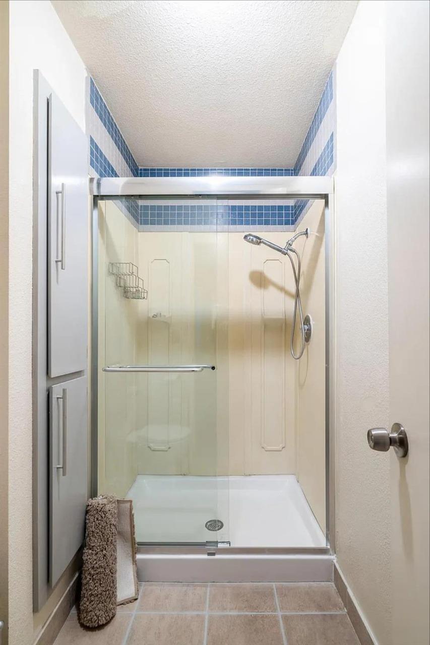 1504 Pierce Drive, Unit 102 Clovis, CA 93612 - Photo 15 of 20 a bathroom with a shower