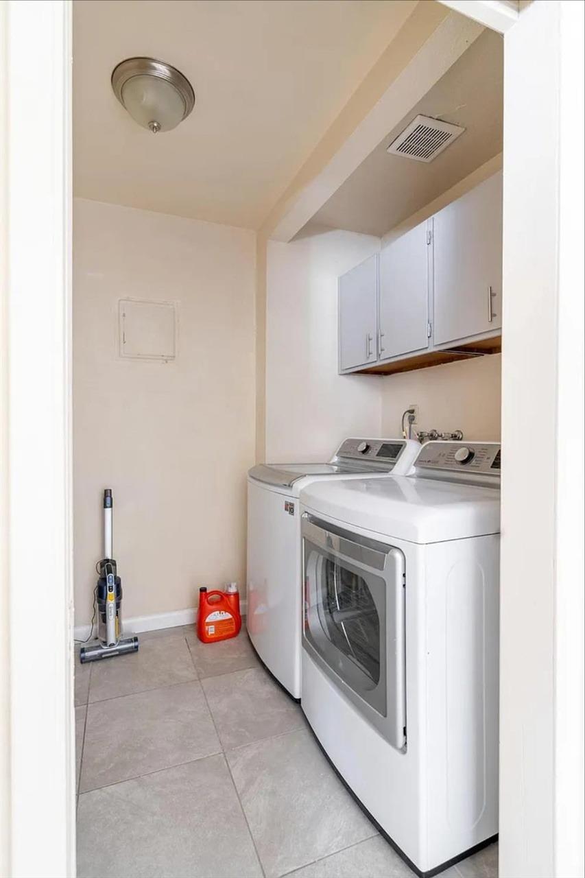 1504 Pierce Drive, Unit 102 Clovis, CA 93612 - Photo 16 of 20 a utility room with dryer and washer