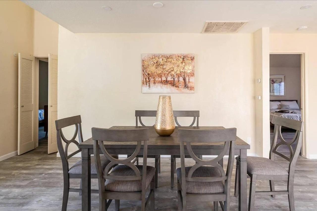 1504 Pierce Drive, Unit 102 Clovis, CA 93612 - Photo 4 of 20 a view of a dining room with furniture and wooden floor