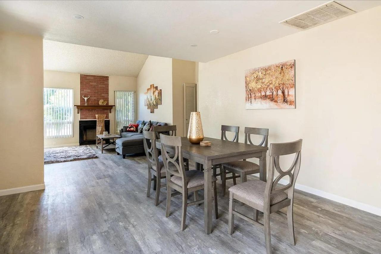 1504 Pierce Drive, Unit 102 Clovis, CA 93612 - Photo 6 of 20 a view of a dining room with furniture and wooden floor