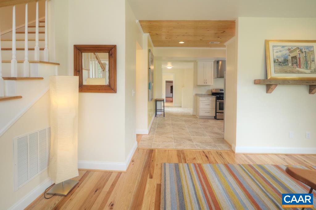 268 Dry Bridge Road Charlottesville, VA 22903 - Photo 14 of 36 a view of a bedroom with wooden floor and a bathroom