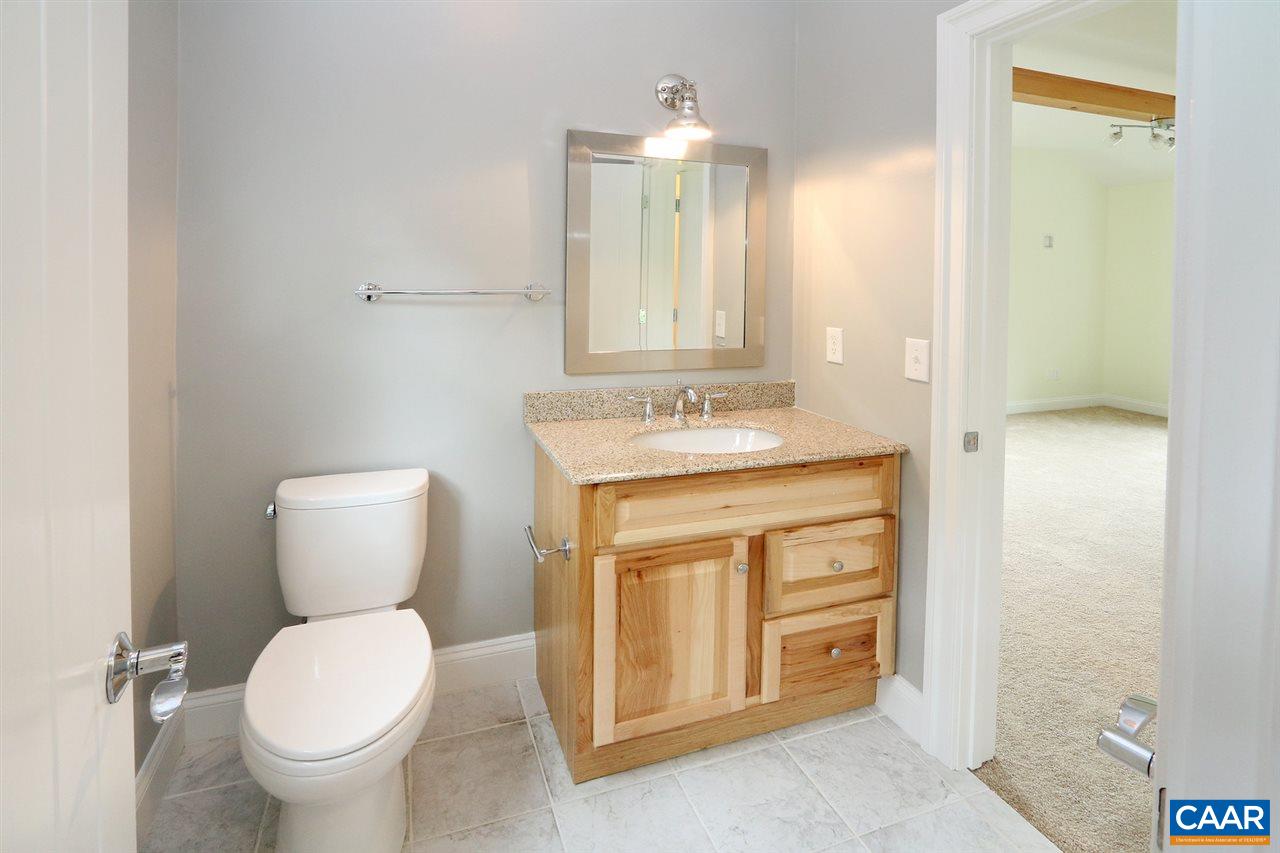 268 Dry Bridge Road Charlottesville, VA 22903 - Photo 29 of 36 a bathroom with a toilet sink and mirror
