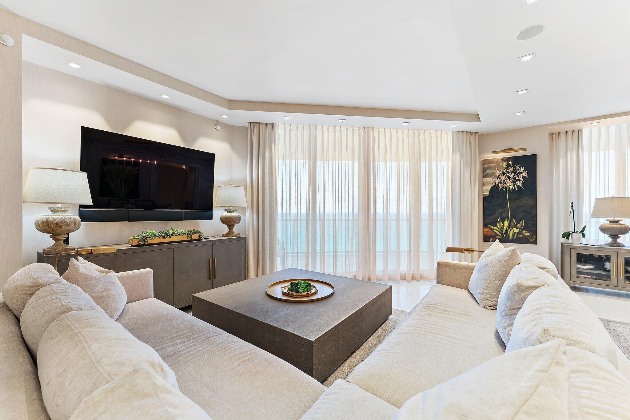 2700 North Ocean Drive, Unit 2304B Singer Island, FL 33404 - Photo 15 of 73 a living room with furniture and a flat screen tv
