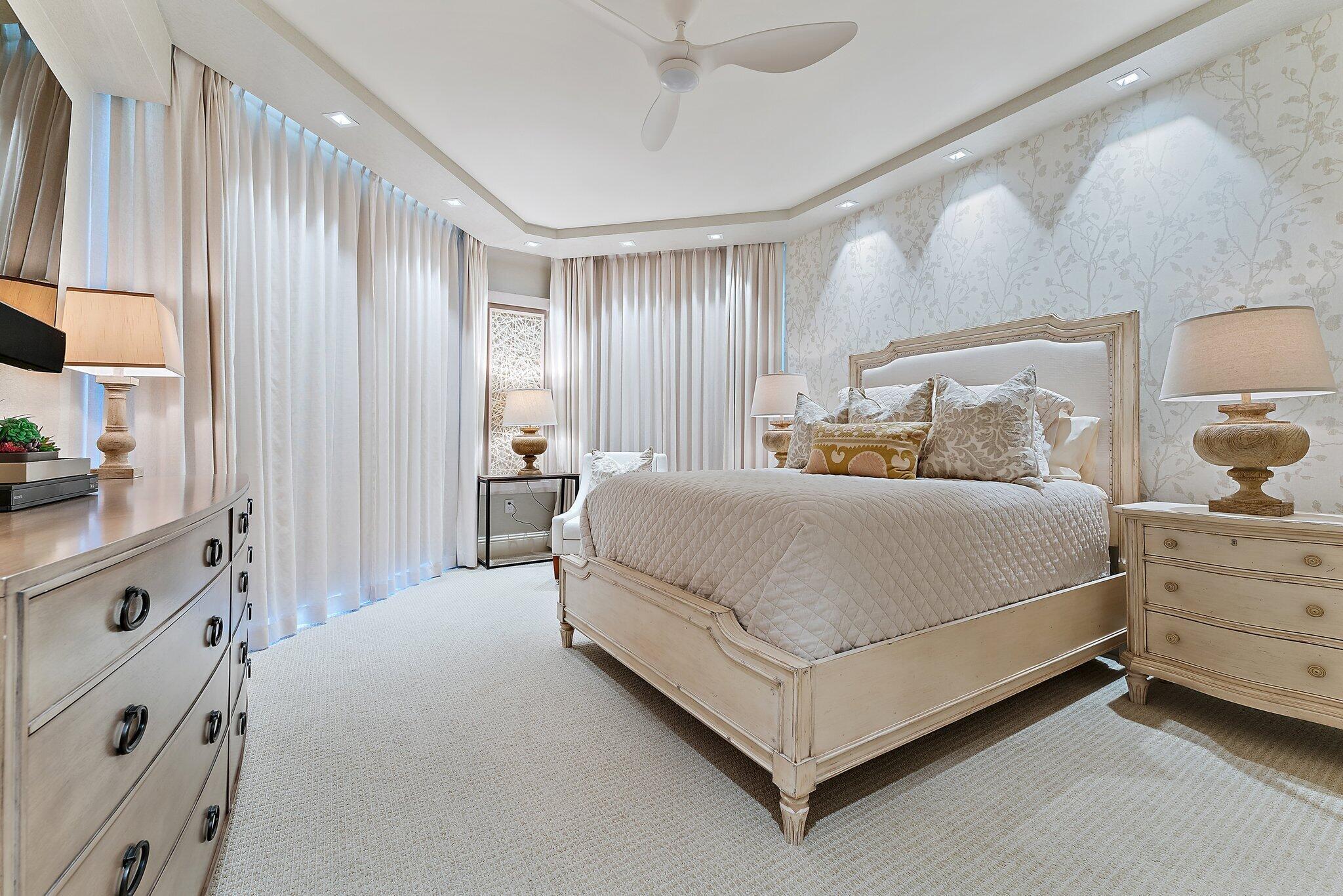 2700 North Ocean Drive, Unit 2304B Singer Island, FL 33404 - Photo 38 of 73 a spacious bedroom with a bed and a dresser