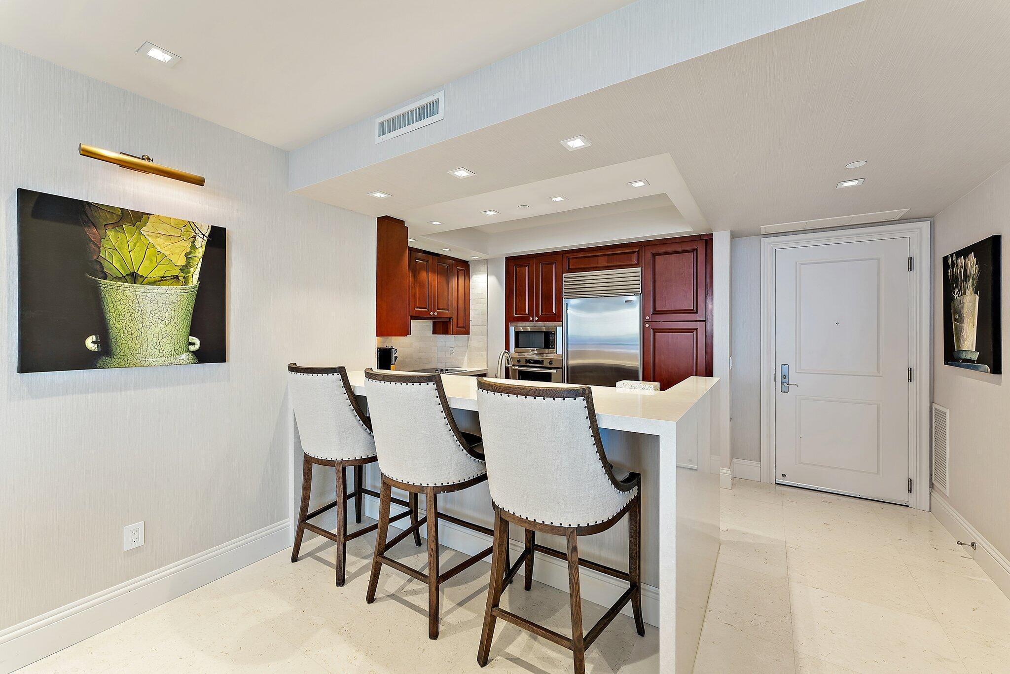 2700 North Ocean Drive, Unit 2304B Singer Island, FL 33404 - Photo 5 of 73 a view of a dining room with furniture