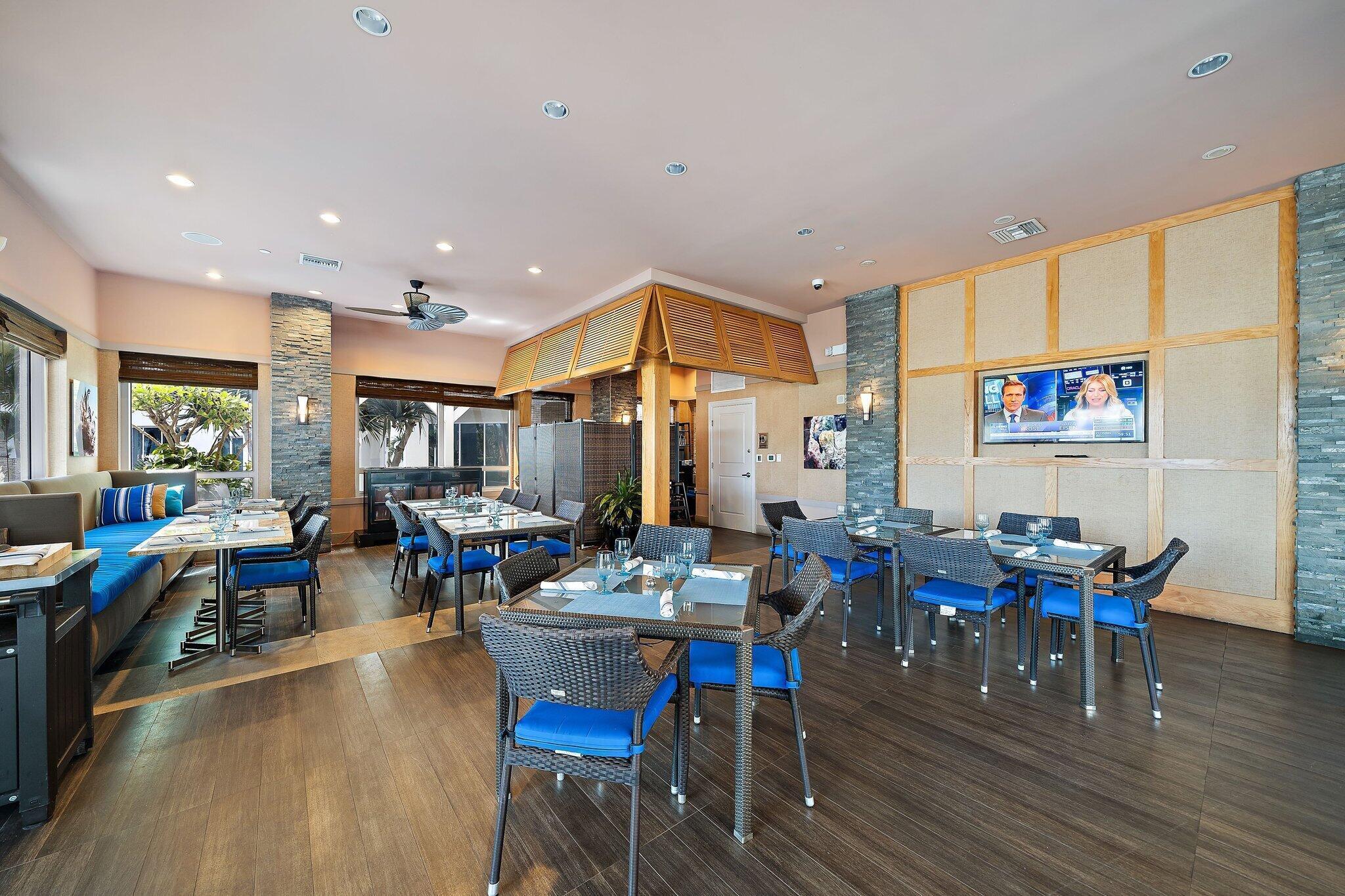 2700 North Ocean Drive, Unit 2304B Singer Island, FL 33404 - Photo 57 of 73 a view of a dining room with furniture window and wooden floor