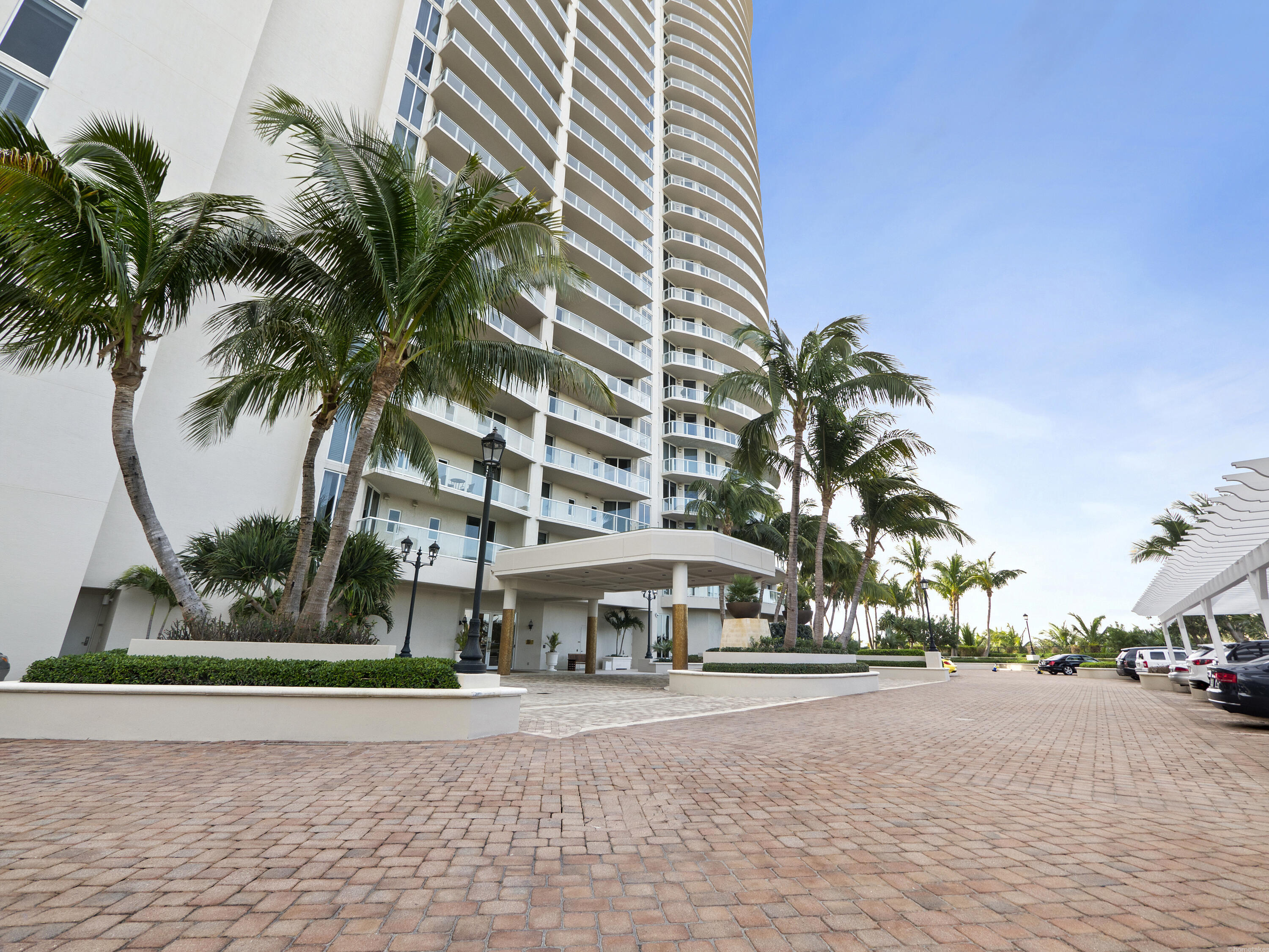 2700 North Ocean Drive, Unit 2304B Singer Island, FL 33404 - Photo 68 of 73 a front view of multiple houses with yard and green space