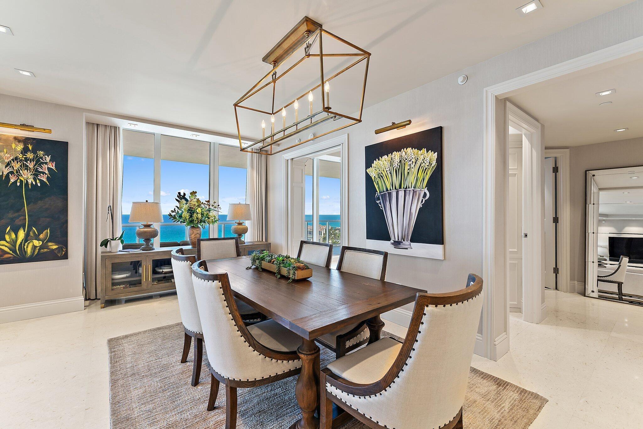 2700 North Ocean Drive, Unit 2304B Singer Island, FL 33404 - Photo 7 of 73 a view of a dining room with furniture window and wooden floor