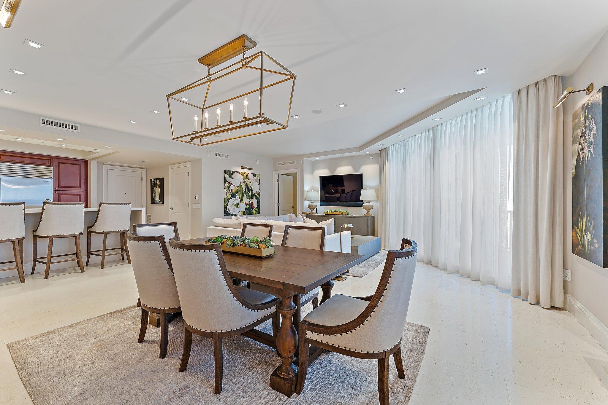 2700 North Ocean Drive, Unit 2304B Singer Island, FL 33404 - Photo 9 of 73 a view of a dining room with furniture and a livingroom
