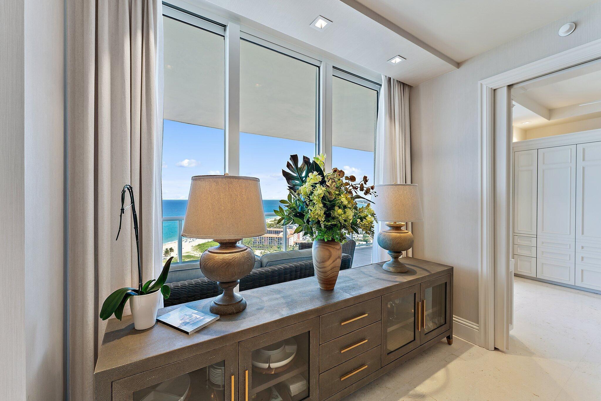 2700 North Ocean Drive, Unit 2304B Singer Island, FL 33404 - Photo 10 of 73 a dining room with furniture and a potted plant
