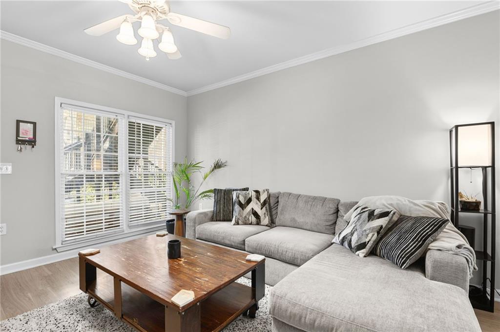 3675 Peachtree Road Northeast, Unit 45 Atlanta, GA 30319 - Photo 27 of 42 a living room with furniture and a window