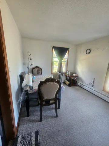 a bedroom with bed and window