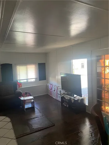 a living room with a couch and a window