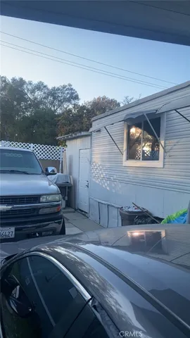 a view of a car park in front of the house