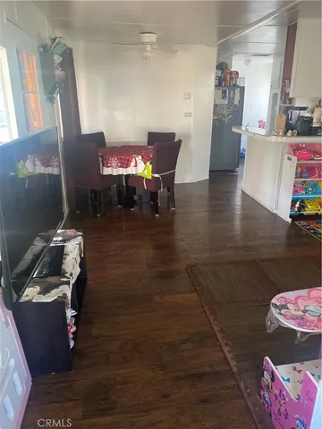 a room with furniture and wooden floor