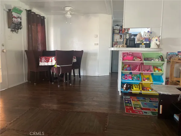 a play room with furniture and wooden floor
