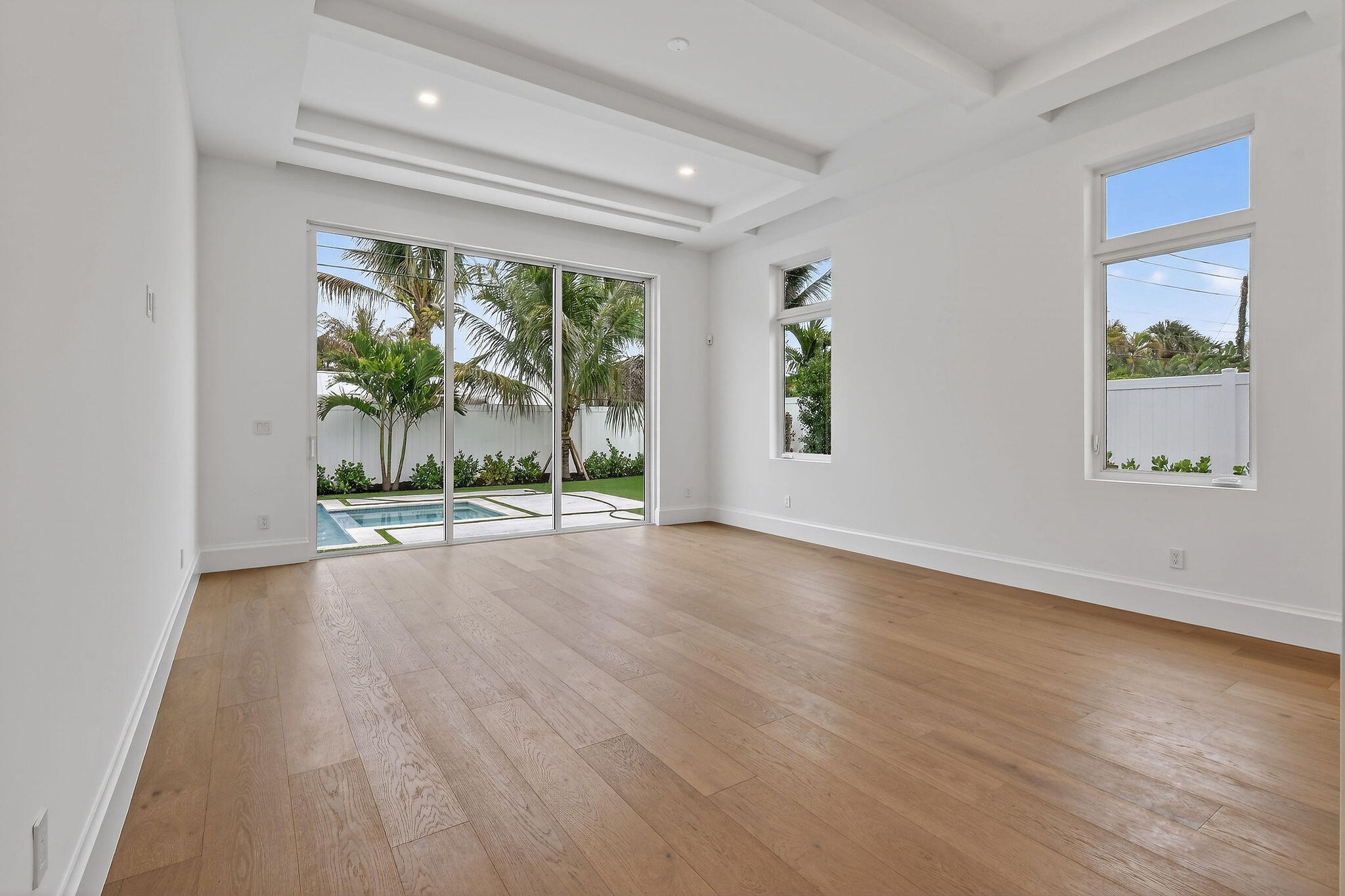 192 River Drive Jupiter, FL 33469 - Photo 12 of 45 wooden floor in an empty room with a window