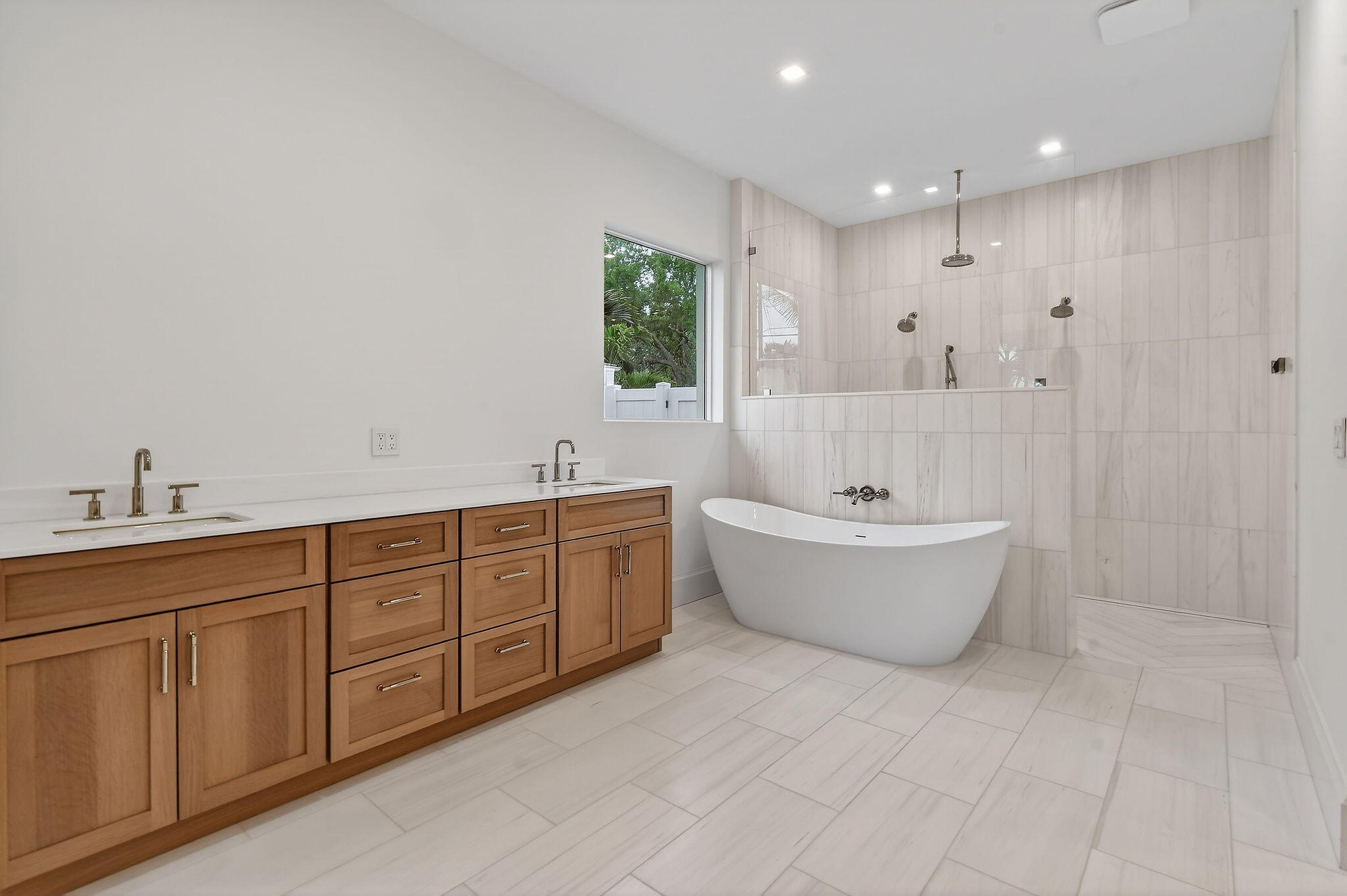 192 River Drive Jupiter, FL 33469 - Photo 14 of 45 a large spacious bathroom with a double vanity sink a mirror and a bathtub