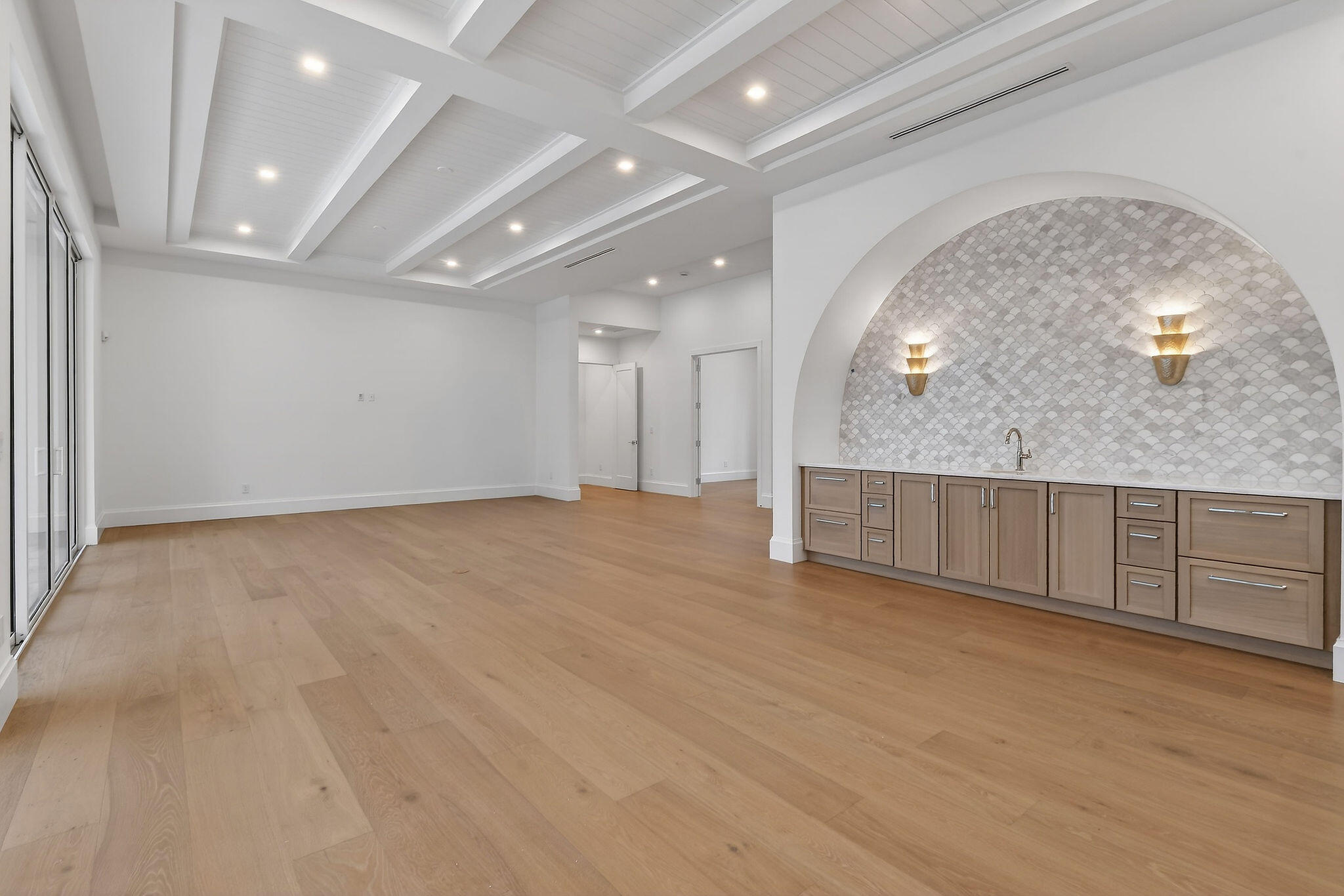 192 River Drive Jupiter, FL 33469 - Photo 5 of 45 an empty room with wooden floor and mirror