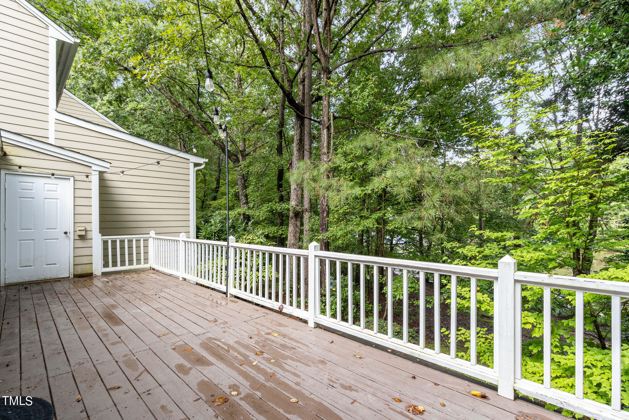 7831 Breckon Way Raleigh, NC 27615 - Photo 27 of 29 a view of a wooden deck and a yard with wooden fence