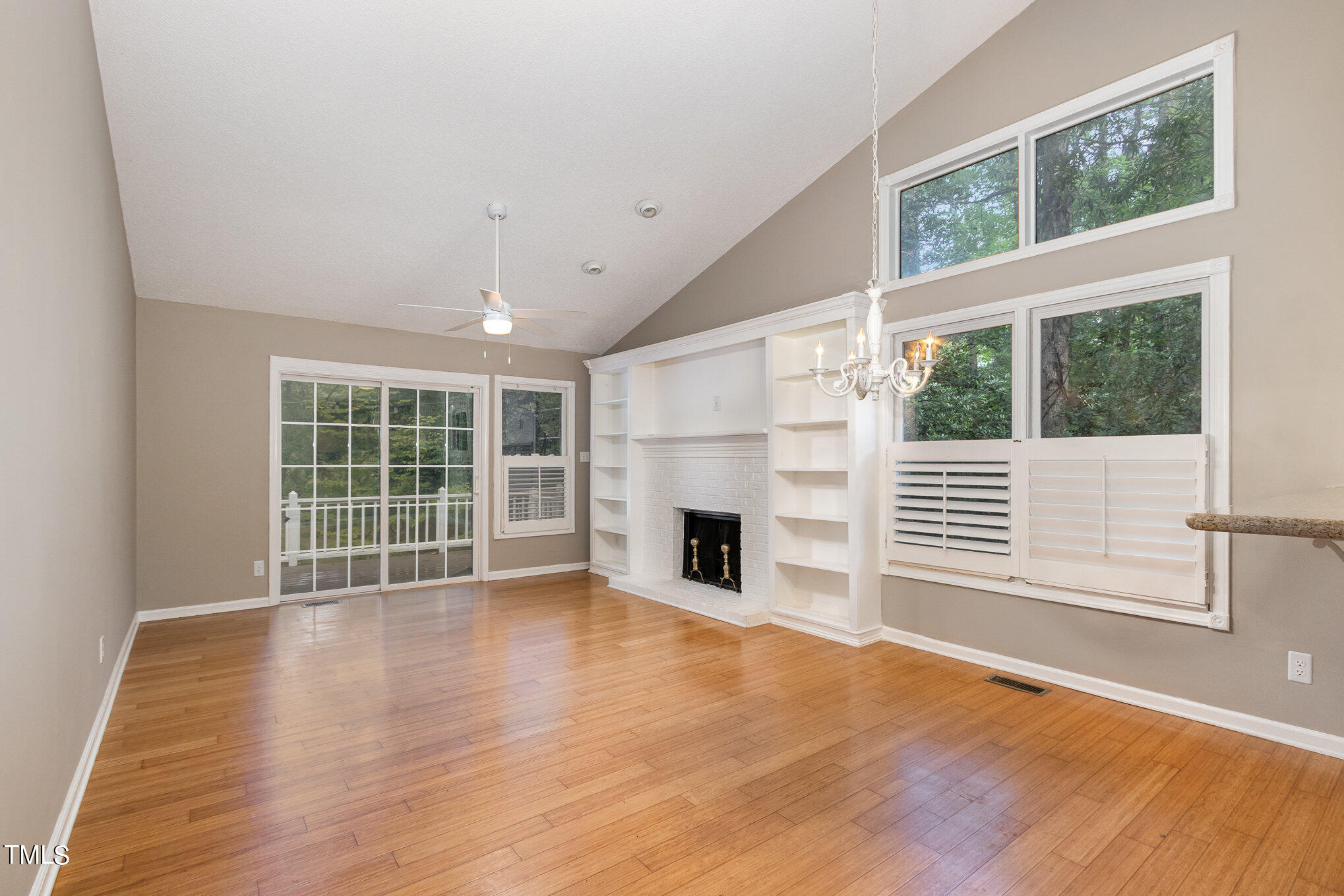 7831 Breckon Way Raleigh, NC 27615 - Photo 3 of 29 a view of a livingroom with a fireplace and window