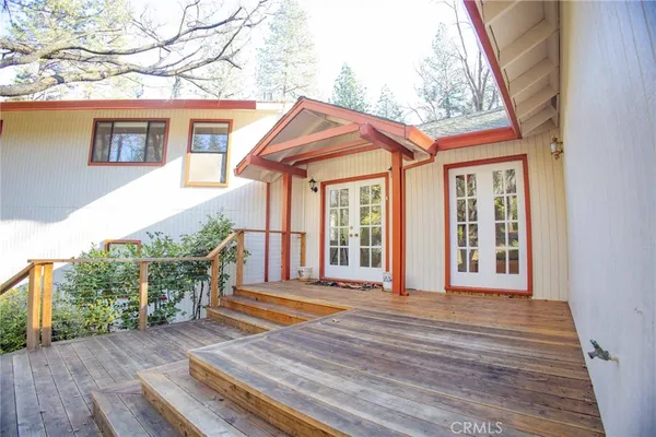 a porch with seating space and yard in back