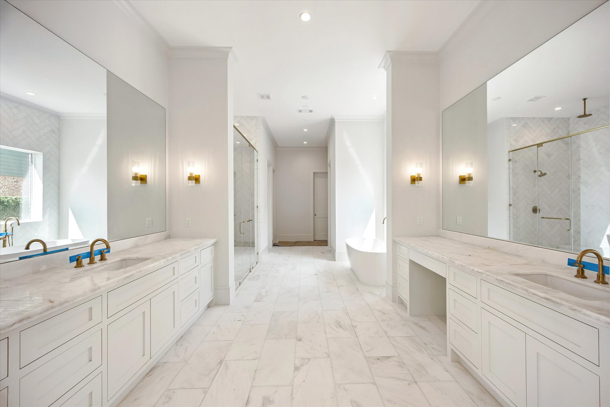 6011 Stones Throw Road Houston, TX 77057 - Photo 13 of 23 Luxurious primary bath – features double vanities accented by elegant designer sconces.
