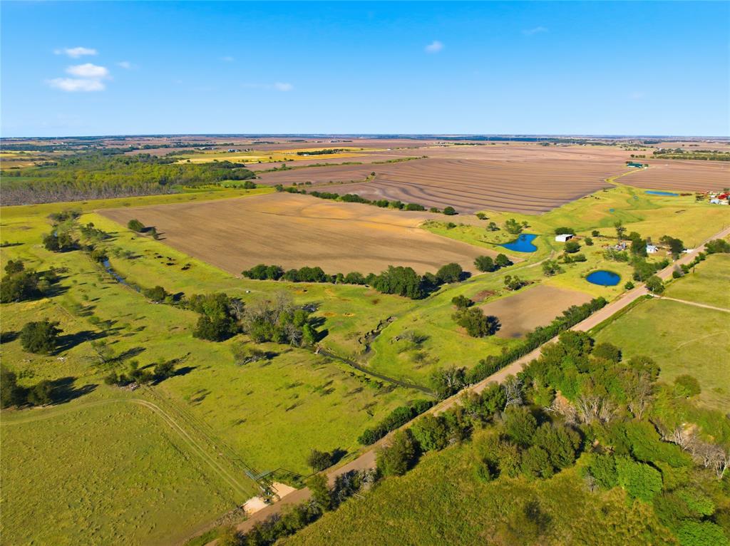 2663 West Crabb Road West, TX 76691 - Photo 1 of 22 Aerial view of property and surrounding area featuring rural landscape