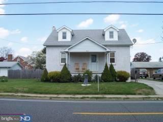 417 Democrat Road Gibbstown, NJ 08027 - Photo 1 of 3 a front view of a house with a yard