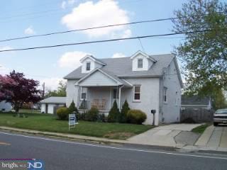 417 Democrat Road Gibbstown, NJ 08027 - Photo 2 of 3 a front view of a house with a yard