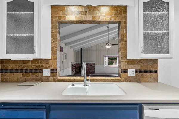 a kitchen with a sink and a refrigerator