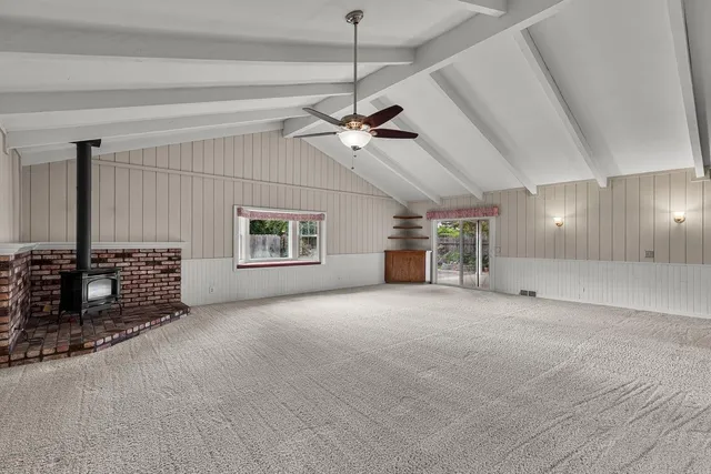 a view of a livingroom with furniture and a ceiling fan