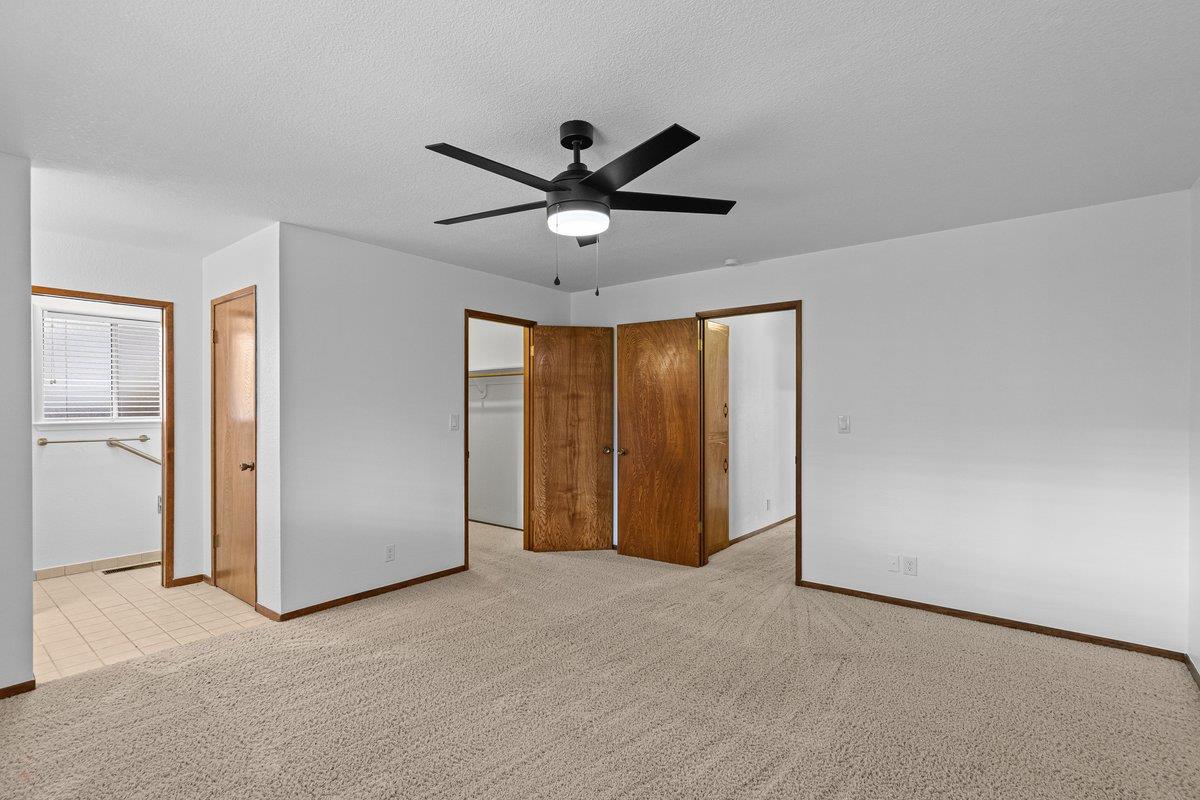 244 California Street Ripon, CA 95366 - Photo 24 of 34 a view of an empty room and a ceiling fan window