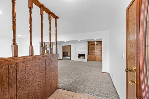 a view of a balcony with furniture and floor to ceiling window