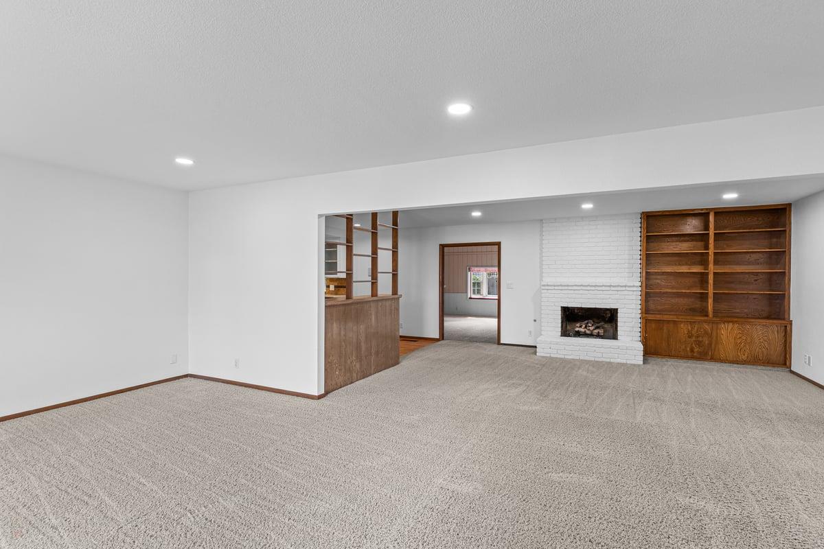 244 California Street Ripon, CA 95366 - Photo 8 of 34 an empty room with furniture and fireplace