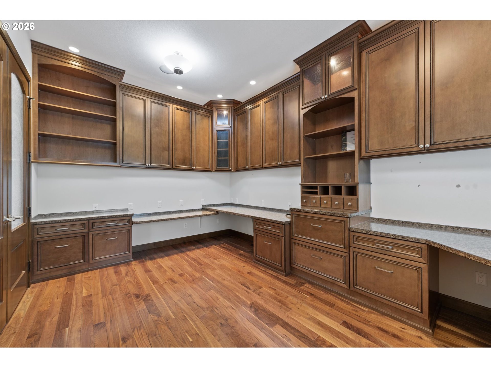 121 Ridge Drive La Grande, OR 97850 - Photo 12 of 43 a kitchen with cabinets wooden floor and stainless steel appliances