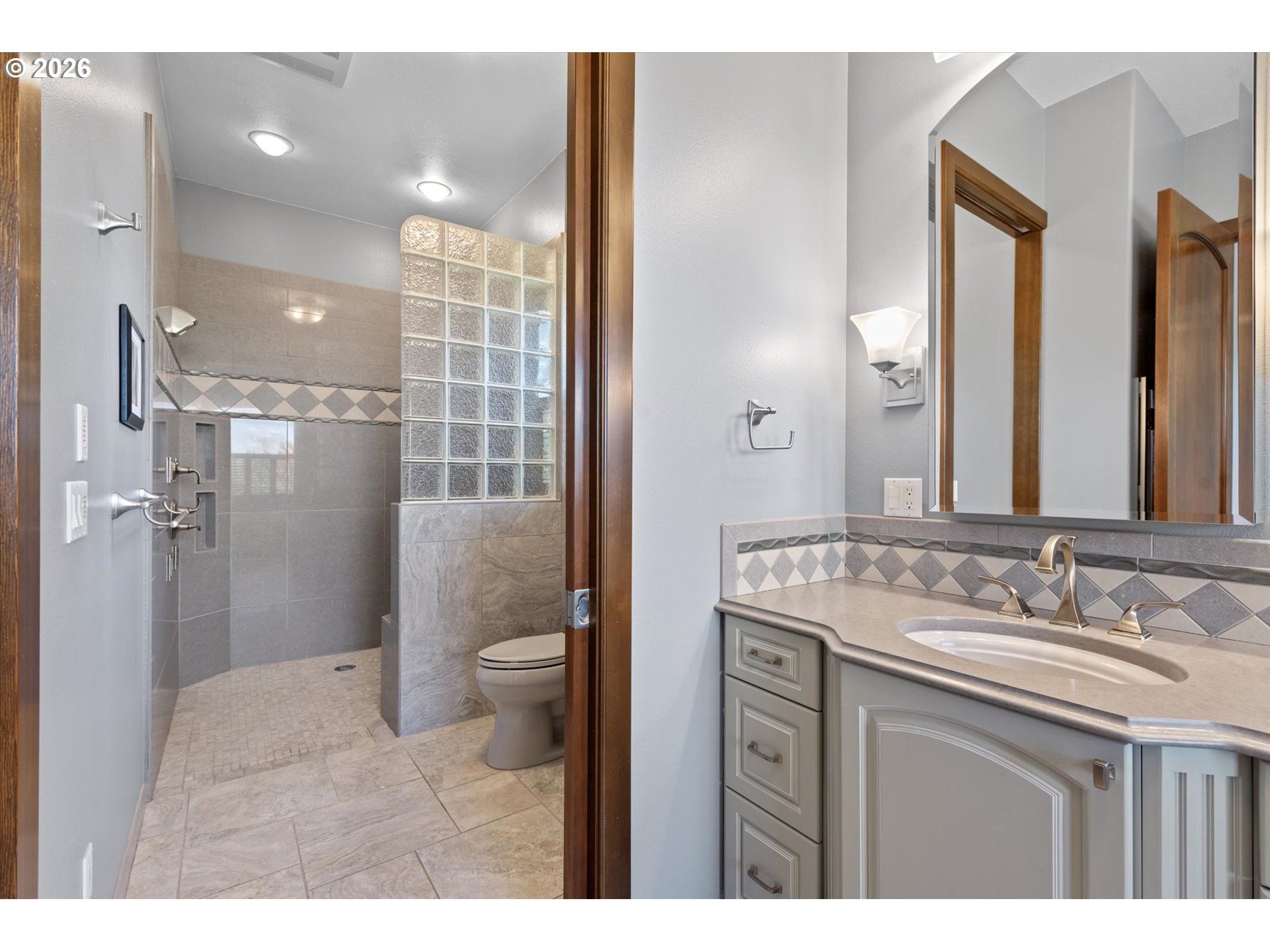 121 Ridge Drive La Grande, OR 97850 - Photo 26 of 43 a bathroom with a granite countertop sink toilet and shower