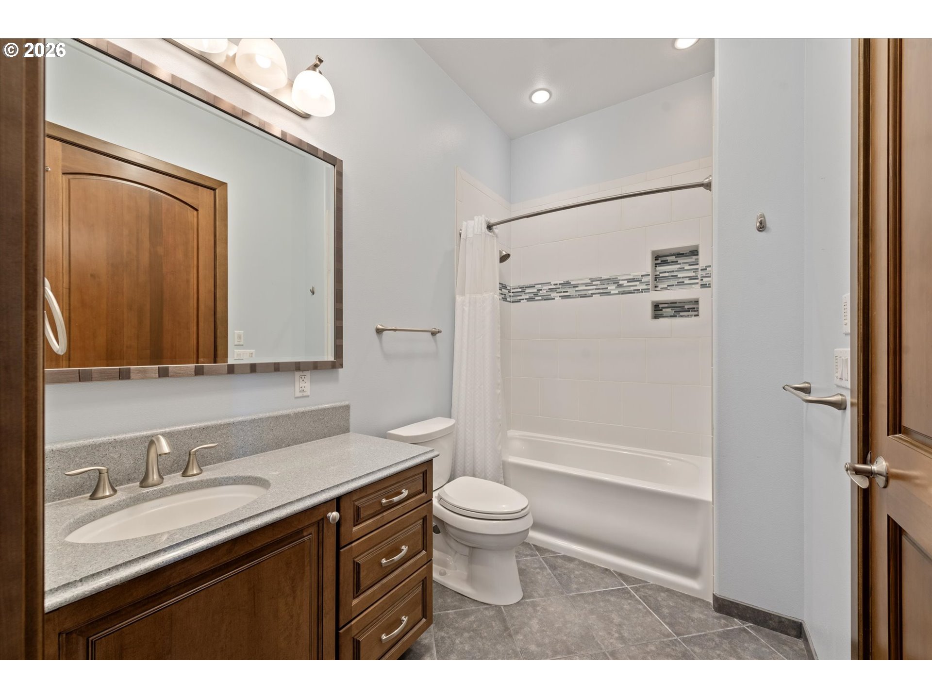 121 Ridge Drive La Grande, OR 97850 - Photo 31 of 43 a bathroom with a sink a toilet a mirror and shower