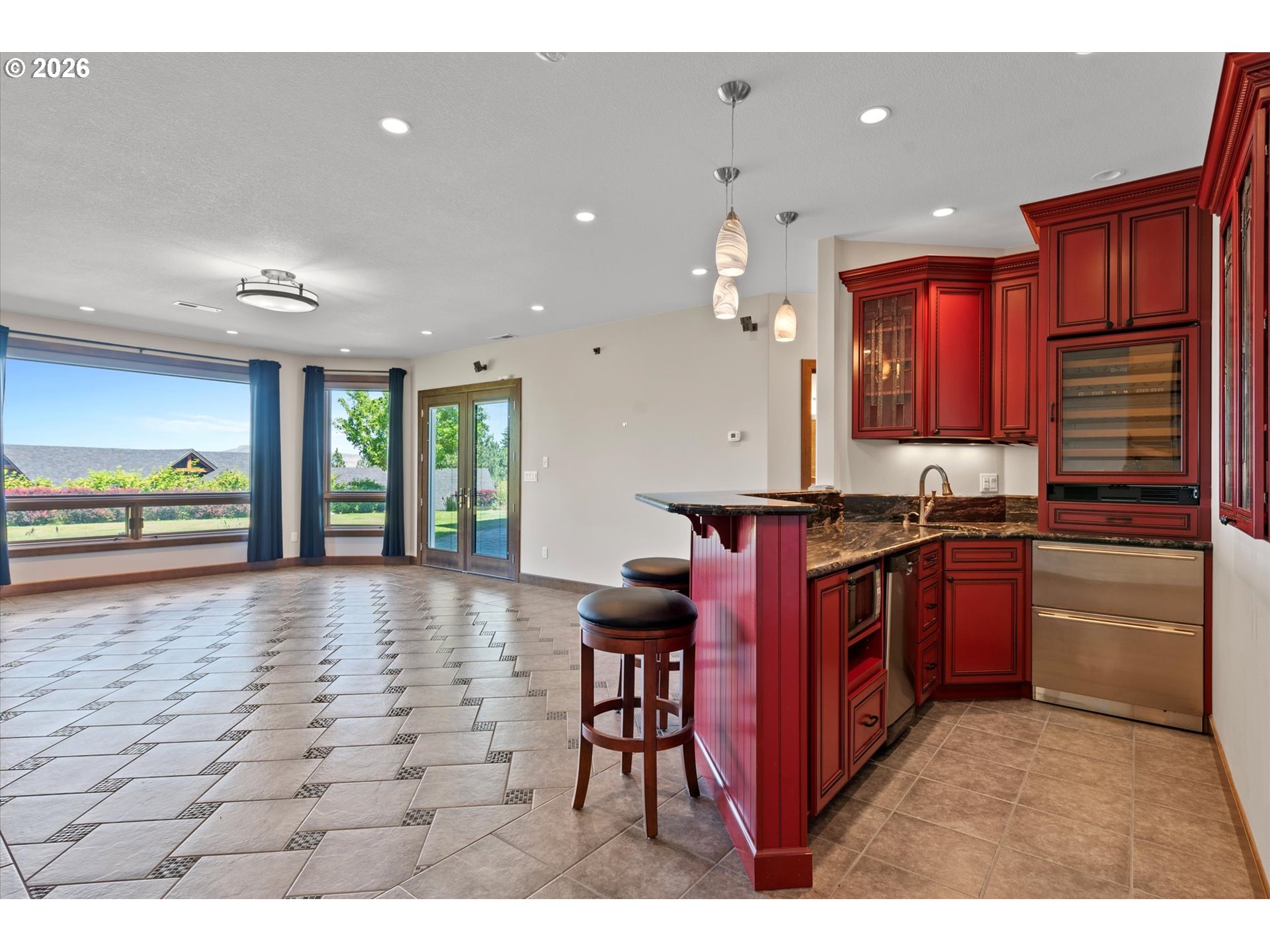 121 Ridge Drive La Grande, OR 97850 - Photo 34 of 43 a kitchen with stainless steel appliances granite countertop a stove a sink and a refrigerator