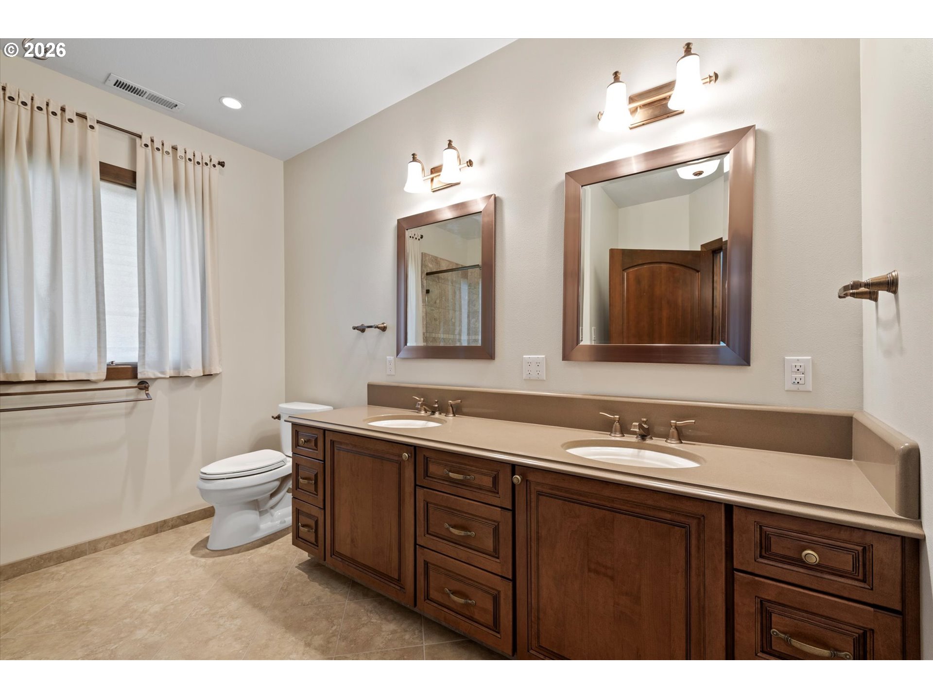 121 Ridge Drive La Grande, OR 97850 - Photo 39 of 43 a bathroom with a double vanity sink and a mirror