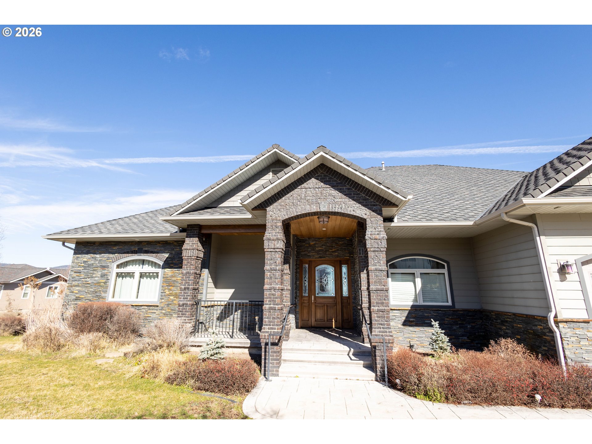 121 Ridge Drive La Grande, OR 97850 - Photo 41 of 43 a view of a house with large windows and yard