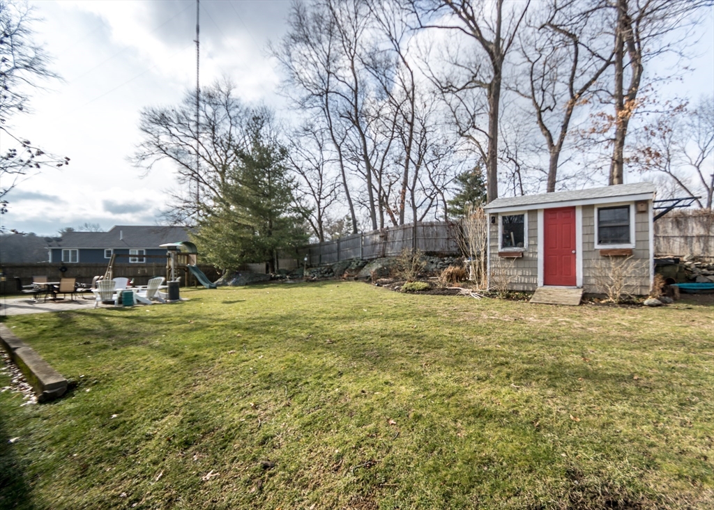 27 Sherman Street Needham, MA 02494 - Photo 31 of 32 a view of a yard with a house
