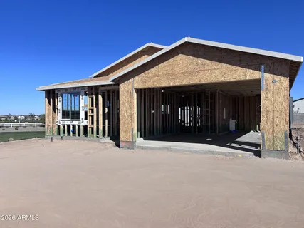 a front view of a house with yard and glass windows