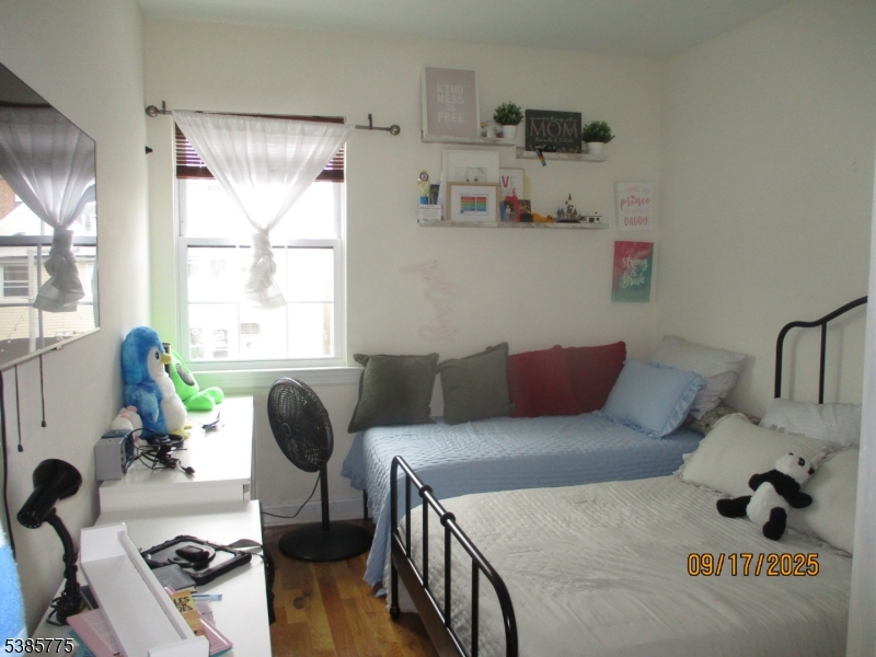 63 Warwick Street Newark, NJ 07105 - Photo 12 of 17 a living room with furniture and a window