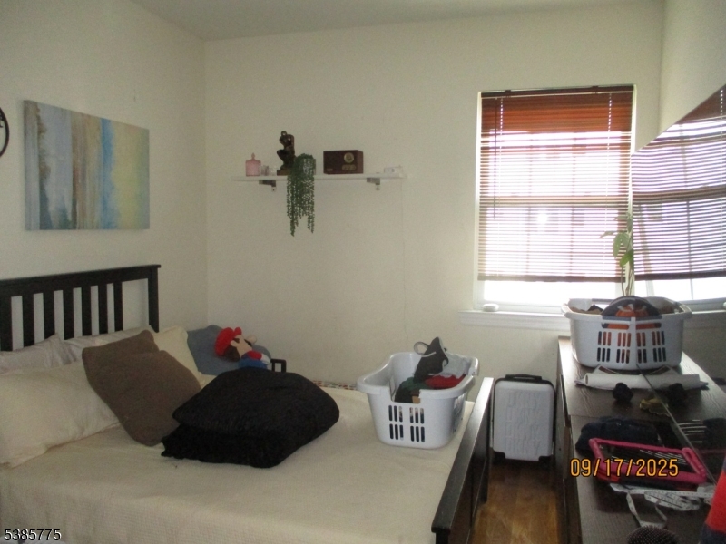 63 Warwick Street Newark, NJ 07105 - Photo 13 of 17 a living room with furniture and a window