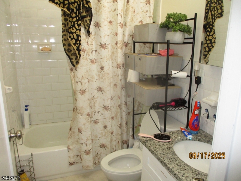 63 Warwick Street Newark, NJ 07105 - Photo 14 of 17 a bathroom with a sink toilet and shower