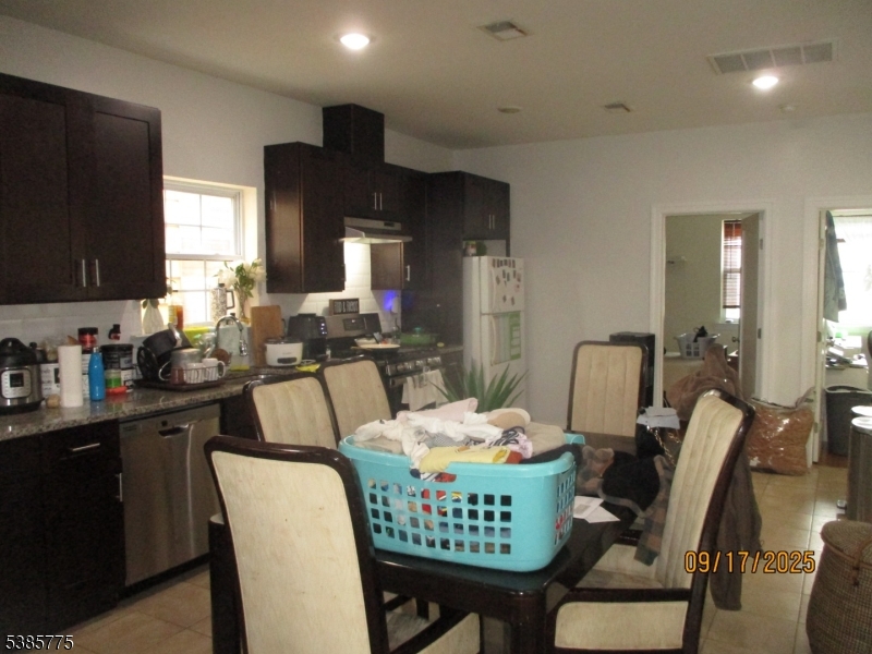 63 Warwick Street Newark, NJ 07105 - Photo 9 of 17 a dining room with furniture and window